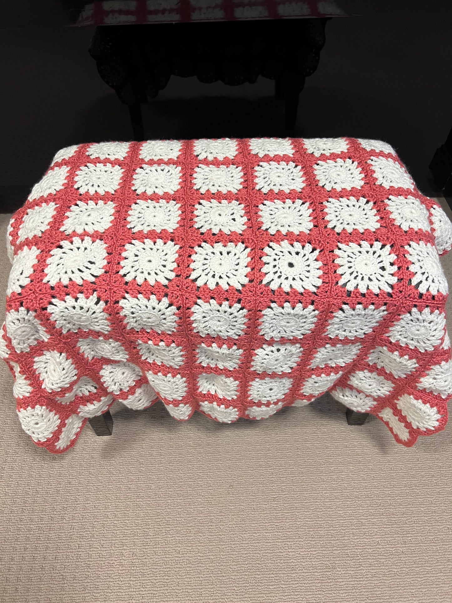 Pink and white granny square knee rug