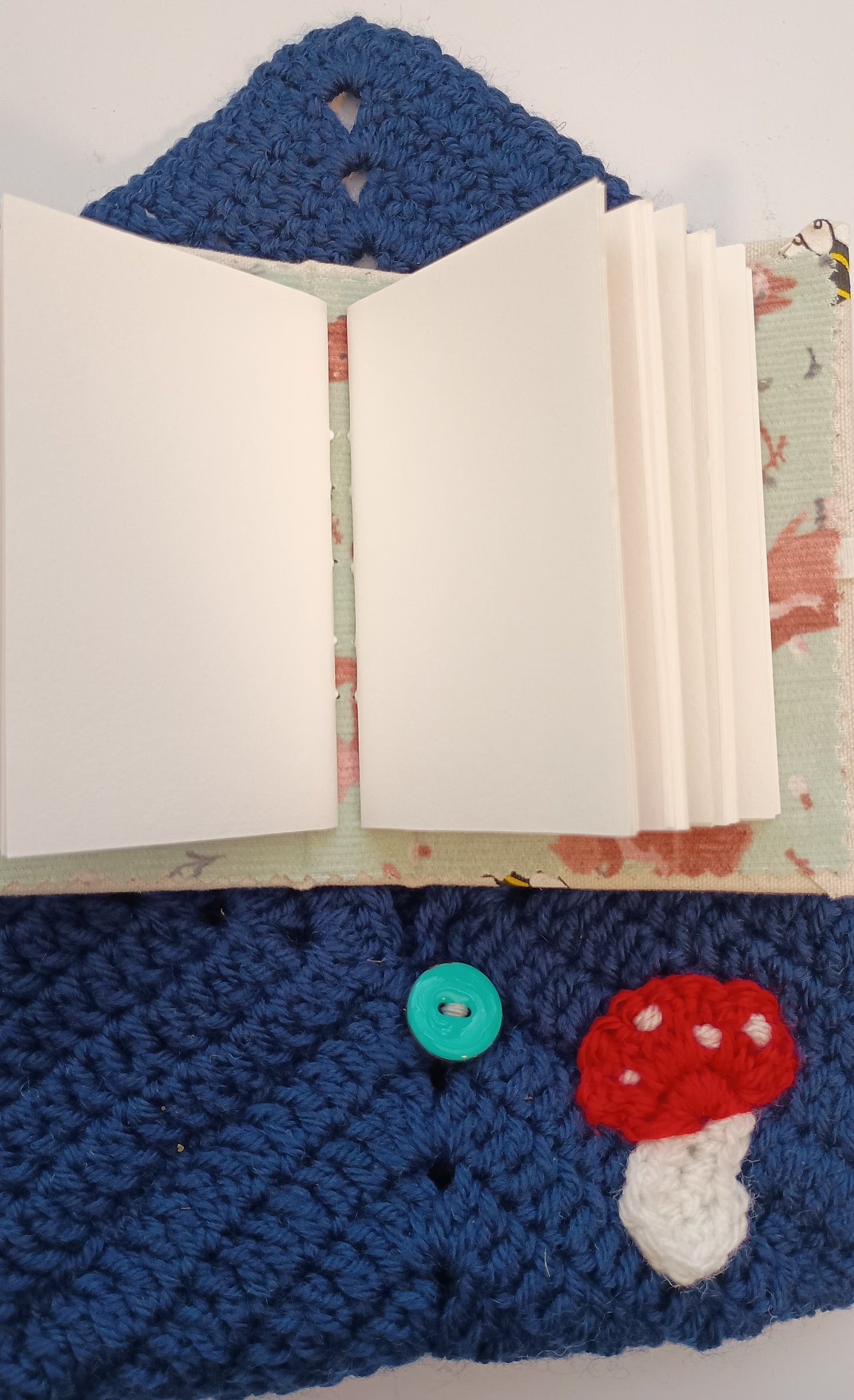 Crocheted mushroom notebook pouch with mini notebook