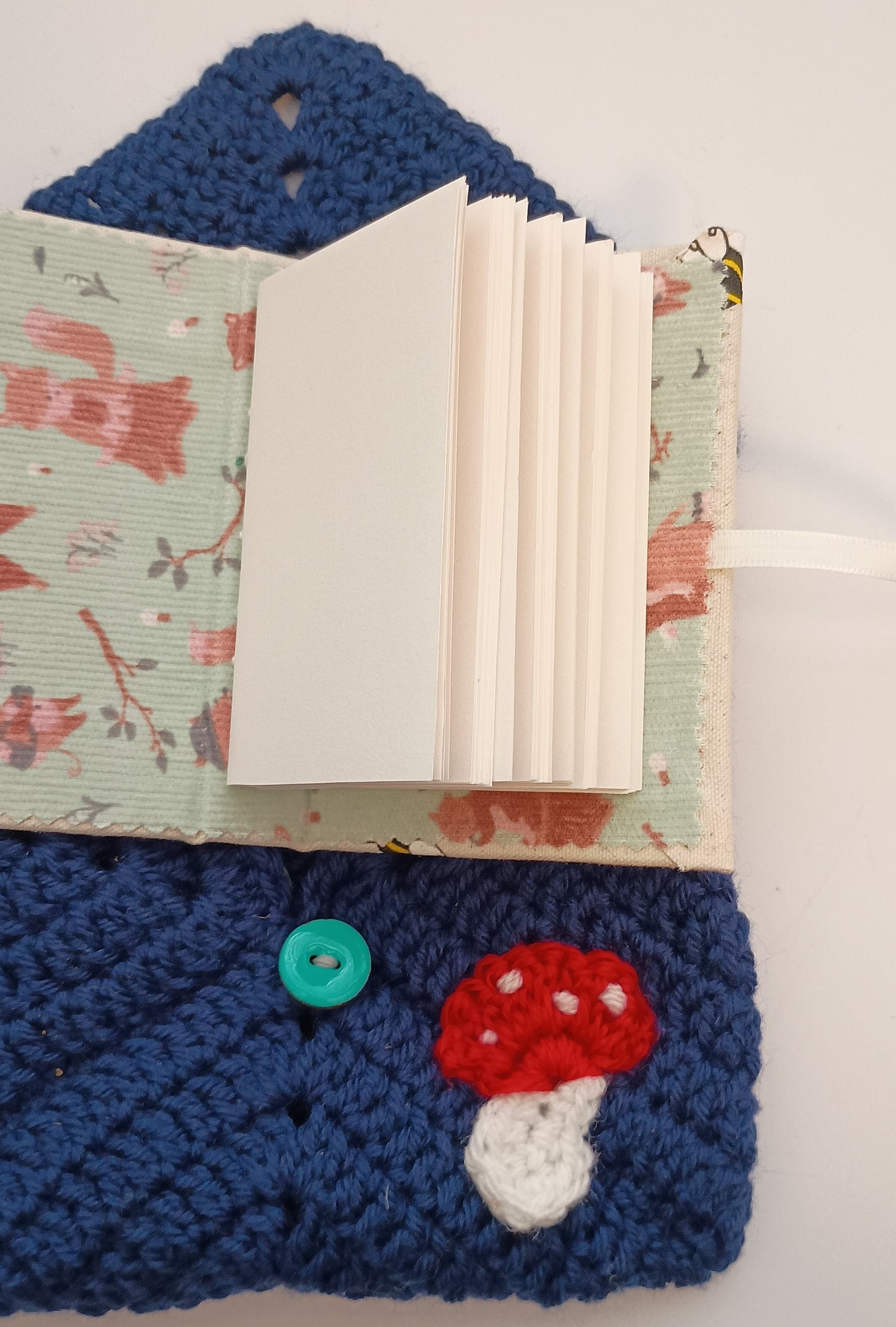 Crocheted mushroom notebook pouch with mini notebook