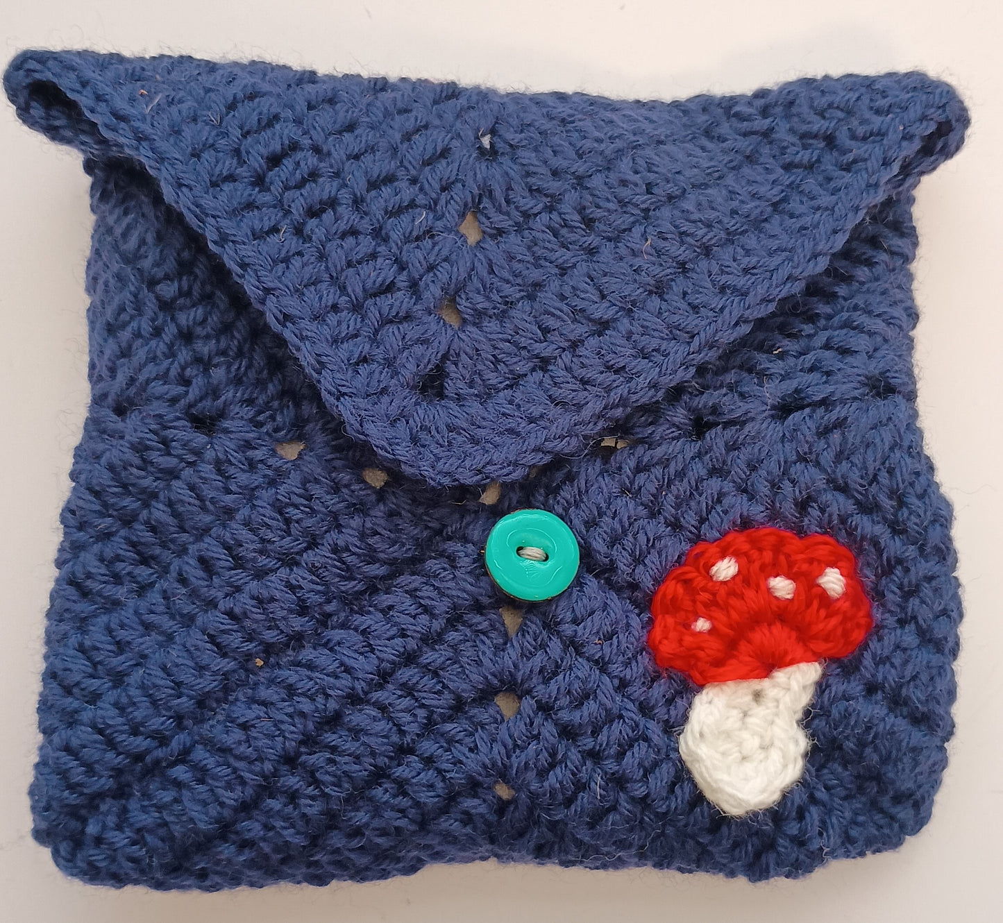 Crocheted mushroom notebook pouch with mini notebook